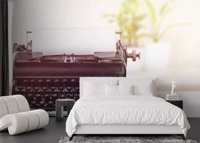 Vintage typewriter and crumpled papers on the desk Wall mural