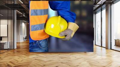 Worker man with helmet on background Wall mural