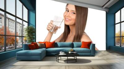 Young beautiful woman holding glass with water isolated on white background Wall mural