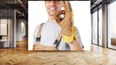 Young male builder in helmet showing okay on a white background Wall mural