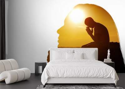 Young man pray outdoor on top of mountains in the sunset Wall mural