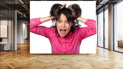 Young woman screaming and holding hair in horror on a white background Wall mural