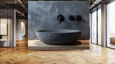 Close up of stylish stone round vessel sink on rustic wooden counter and black wall mounted faucet on grey stucco wall with copy space Minimalist interior design of modern bathroom Wall mural