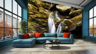  The stones under the waterfall, close-up waterfall as background. Wall mural