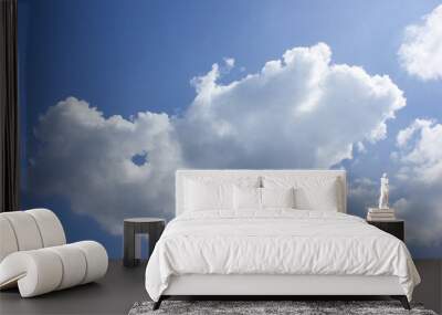 A blue sky with puffy clou Wall mural