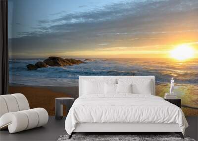 Glowing skies at dusk on a summer evening on an Atlantic ocean beach. Wall mural