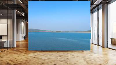 River with clear blue sky and green forest background, blue lake panoramic view Wall mural