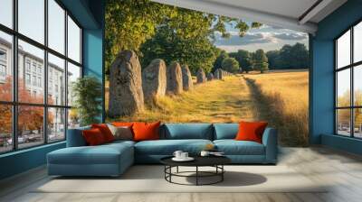 Mysterious stone monoliths in a serene countryside landscape Wall mural