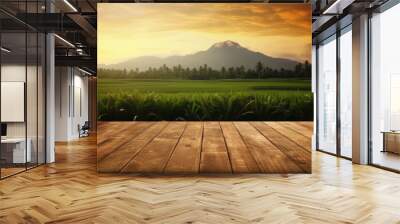 Table wooden board with rice field , mountain and sunset background ,Generative AI. Wall mural