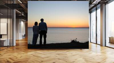 Hand in hand by sunset Wall mural