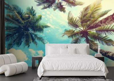 Background with a landscape of tall palm trees looking up at the blue sky during the day Wall mural