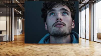 Portrait of a Young Man Looking Up Wall mural