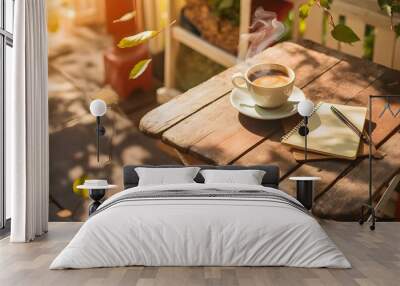 A cup of coffee over a wooden table in a sunny day Wall mural