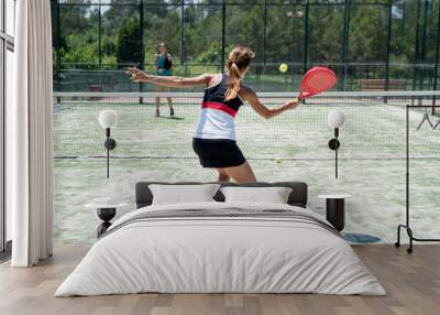 Two women playing padel outdoor Wall mural