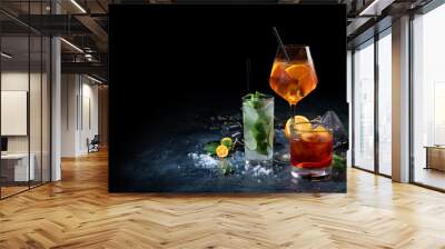 Cocktails assortment served on dark background. Wall mural