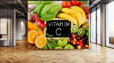 Foods High in vitamin C on wooden board.  Healthy eating. Wall mural