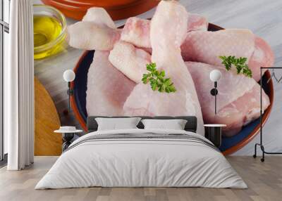 Fresh raw chicken legs on a plate Wall mural