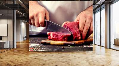 Man cutting beef meat Wall mural