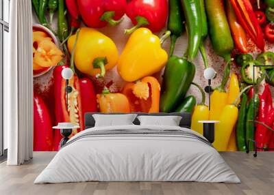 Peppers assorty on wooden background. Tasty vegetables. Colorful organic food. Wall mural