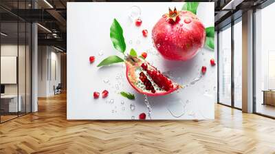 Pomegranate with water drops and leaves on a white background. Red sweet fruit Wall mural