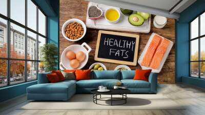 Selection of healthy fat sources on wooden background Wall mural