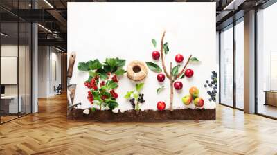 Springtime gardening composition on neutral background. Wall mural