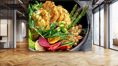 Vegan buddha bowl. Bowl with  vegetables, Zucchini fritters and vegetables chips. Wall mural