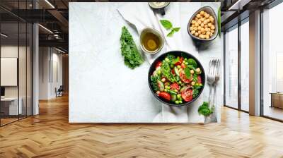 Vegan salad with cucumber, tomato, spinach, lettuce, onion, green pea and chickpea Wall mural