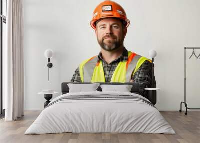 Worker wearing hard hat smiling positively Wall mural