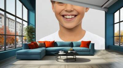 Portrait of smiling boy in a white t-shirt Wall mural