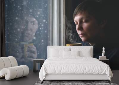 Lonesome Woman Drinking Coffee in Dark Room Wall mural