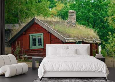 Old scandinavian farm house with green roof in town of Halmstad, Sweden Wall mural