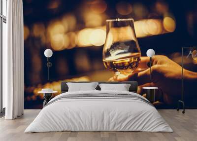 Hand holding a Glencairn single malt whisky glass Wall mural