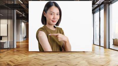 Immunization for viral disease. Beautiful Asian woman showing shoulders after getting a vaccine. Happy woman showing arm with band-aids on after vaccine injection. Healthcare and Medical concept. Wall mural