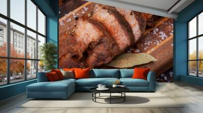 Oven Roasted Pork with spices on wooden cutting board. Wall mural