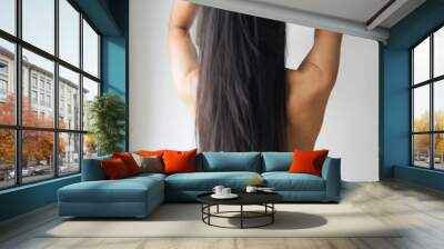 Young woman Asian with beautiful long straight black hair. Wall mural