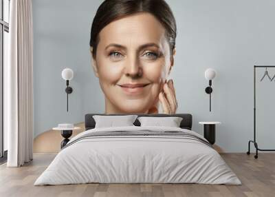 Beautiful middle aged woman with clean wrinkled skin Wall mural