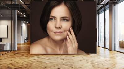 Beautiful middle aged woman with clean wrinkled skin Wall mural