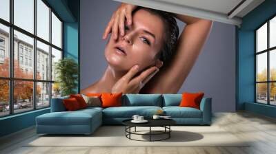 Beautiful woman with oily and wet skin Wall mural