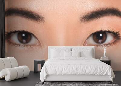 Close-up of Asian eyes. Wall mural