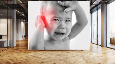 Crying baby suffering from a ear pain Wall mural