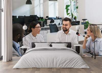 Multi-ethnic business people during meeting in modern office Wall mural