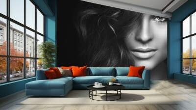 Woman with curly hair and beautiful make-up Wall mural