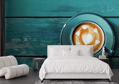 Hot Coffee Latte Cup on Blue Wooden Table. Top View. Latte Art in Heart Shape Wall mural