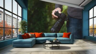 close-up on photographer hand holding camera Wall mural