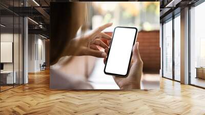 mock up phone in woman hand showing white screen Wall mural