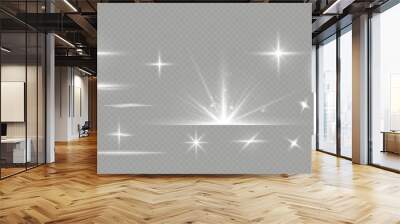 White sparkles.Bright star.Glow burst.Rays of the sun on a transparent background. Wall mural