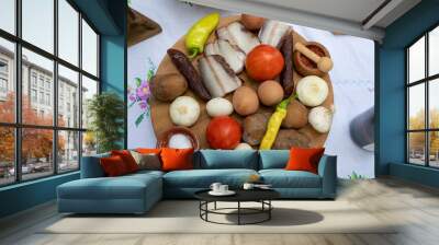 Balkan food bacon, onions, tomatoes, sausages and boiled eggs Wall mural