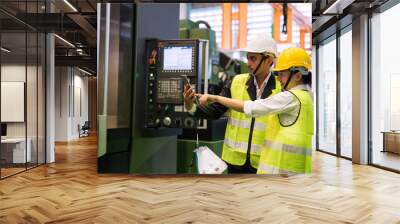 Factory workers check productivity in tablet Wall mural