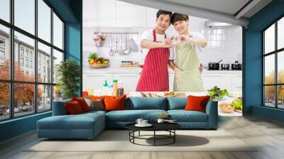 LGBT couple hand gesture heart shape in kitchen Wall mural